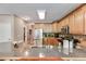 Granite countertops and plentiful wood cabinets adorn this home's stylish kitchen at 4828 Planters Walk, Douglasville, GA 30135