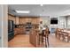 Well-lit kitchen features wood cabinets, stainless steel appliances, and an island with bar seating at 4828 Planters Walk, Douglasville, GA 30135