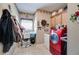 Laundry room featuring a modern red washer and dryer, with built in cabinets and decor at 4828 Planters Walk, Douglasville, GA 30135
