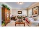 Comfortable living room with neutral walls, carpet flooring, sofas, and natural light from the window at 4828 Planters Walk, Douglasville, GA 30135