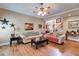 Bright living room with hardwood floors, comfortable sofas, and decorative accents at 4828 Planters Walk, Douglasville, GA 30135