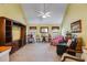 Bright living room with vaulted ceiling, built-in shelving, and comfortable seating at 4828 Planters Walk, Douglasville, GA 30135