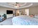 Spacious main bedroom with trey ceilings, carpet, ceiling fan, television, and sitting area at 4828 Planters Walk, Douglasville, GA 30135