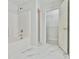 Bathroom featuring a tiled shower and tub with walk in closet at 6125 Brookechase Ln, Norcross, GA 30093