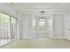 Bright dining area with a bay of windows and a sliding glass door leading to the backyard at 6125 Brookechase Ln, Norcross, GA 30093