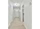 Bright hallway with fresh paint, new flooring, and access to the home's interior spaces at 6125 Brookechase Ln, Norcross, GA 30093