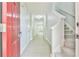 Inviting hallway featuring light gray walls, wood-look flooring and staircase access to the upper level at 6125 Brookechase Ln, Norcross, GA 30093