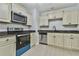 Well-equipped kitchen with new appliances, clean lines, and ample cabinet space at 6125 Brookechase Ln, Norcross, GA 30093