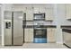 Kitchen featuring stainless steel appliances and neutral cabinetry, perfect for cooking enthusiasts at 6125 Brookechase Ln, Norcross, GA 30093