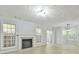 Neutral living room with fireplace, windows, and sliding door at 6125 Brookechase Ln, Norcross, GA 30093