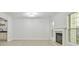 Spacious living room with fireplace, large windows, and neutral paint at 6125 Brookechase Ln, Norcross, GA 30093