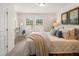 Bright bedroom with a comfortable bed, desk area, and large windows offering scenic views at 6425 Rosetta Drive, Unit 65, South Fulton, GA 30331