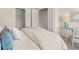 Cozy bedroom featuring a comfortable bed, closet and a modern desk at 6425 Rosetta Drive, Unit 65, South Fulton, GA 30331