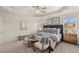 Serene main bedroom with tray ceilings, plush carpeting, and ample natural light from the double windows at 6425 Rosetta Drive, Unit 65, South Fulton, GA 30331