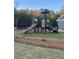 Modern playground with a slide and steps in a green space at 6425 Rosetta Drive, Unit 65, South Fulton, GA 30331