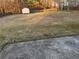 Spacious backyard featuring a storage shed and a wooden fence, offering privacy and ample space at 893 Port West Dr, Auburn, GA 30011