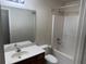 Bathroom with single sink vanity, large mirror, and tub and shower combo at 893 Port West Dr, Auburn, GA 30011