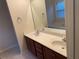 Bathroom with double sink vanity, large mirror, and bathtub for a comfortable and convenient space at 893 Port West Dr, Auburn, GA 30011