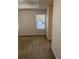 Bright bedroom featuring neutral walls, carpet flooring, and a window offering ample natural light at 893 Port West Dr, Auburn, GA 30011