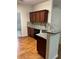 Well-equipped kitchen with dark cabinets, granite countertops, and modern stainless-steel appliances at 893 Port West Dr, Auburn, GA 30011