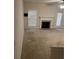 Cozy living room featuring a fireplace and lots of natural light creating a warm, inviting atmosphere at 893 Port West Dr, Auburn, GA 30011