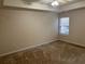 Spacious main bedroom with a tray ceiling and a window, offering natural light and a comfortable living space at 893 Port West Dr, Auburn, GA 30011