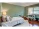 Inviting bedroom offers a workspace with a desk and lots of light from the large window at 126 N Barton St, Norcross, GA 30071