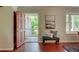 Entryway featuring hardwood floors, bench seating, and a view of the front porch through the open door at 126 N Barton St, Norcross, GA 30071