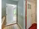 Light-filled entryway with gorgeous wood flooring and convenient access to the outside patio at 126 N Barton St, Norcross, GA 30071