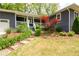 Beautifully landscaped front yard with mature trees and a stone walkway leading to the front porch at 126 N Barton St, Norcross, GA 30071