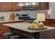 Bright kitchen with stainless steel appliances, granite countertops, and large island with breakfast bar at 126 N Barton St, Norcross, GA 30071