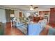Open-concept living room with hardwood floors, comfortable seating, and a view of the kitchen at 126 N Barton St, Norcross, GA 30071