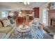 Open concept living room, fireplace, hardwood floors, view of the kitchen and the dining area at 126 N Barton St, Norcross, GA 30071