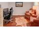 Comfortable home office with hardwood floors, zebra rug, computer and a seating area at 126 N Barton St, Norcross, GA 30071