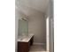 Bathroom featuring double vanity with granite countertop, tile flooring, and bright lighting at 4291 Preserve Trl, Snellville, GA 30039