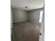 Neutral bedroom with carpet, window, baseboard, and door at 4291 Preserve Trl, Snellville, GA 30039