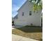 Side view of the home, featuring a two car garage at 4291 Preserve Trl, Snellville, GA 30039