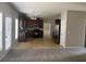 Open kitchen with dark wood cabinets and stainless steel refrigerator at 4291 Preserve Trl, Snellville, GA 30039
