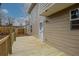 Back deck with wood flooring, tan vinyl siding, and a partial view of the backyard and fence at 1526 Venetian Sw Dr, Atlanta, GA 30311