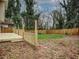 Backyard with a wooden deck, partial grass, and a wood fence surrounding the property at 1526 Venetian Sw Dr, Atlanta, GA 30311