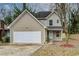 A two-story home with a two-car garage and neat, well-maintained landscaping at 1526 Venetian Sw Dr, Atlanta, GA 30311