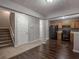 Open-concept area with living room, stairs, and view into the kitchen at 1526 Venetian Sw Dr, Atlanta, GA 30311