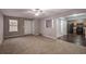 Spacious living room with carpet flooring and an open view of the kitchen at 1526 Venetian Sw Dr, Atlanta, GA 30311