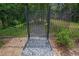 Gated access to a lush, green backyard, offering both privacy and a sense of outdoor adventure at 2557 Avery Park Cir, Atlanta, GA 30360