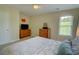 Bright bedroom with soft colors, offering plenty of storage and a view of the outdoors at 2557 Avery Park Cir, Atlanta, GA 30360