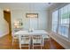 Open dining area with lots of windows for natural light and hardwood floors at 2557 Avery Park Cir, Atlanta, GA 30360