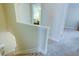 Upstairs hallway with views of bedrooms and neutral carpet at 2557 Avery Park Cir, Atlanta, GA 30360