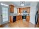 Well-equipped kitchen with wood cabinets, stainless steel appliances, and access to a backyard patio at 2557 Avery Park Cir, Atlanta, GA 30360