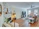 Bright living room with a stone fireplace, hardwood floors, and comfortable furnishings at 2557 Avery Park Cir, Atlanta, GA 30360