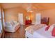Spacious main bedroom with hardwood floors, sitting area, and decorative lighting at 2557 Avery Park Cir, Atlanta, GA 30360